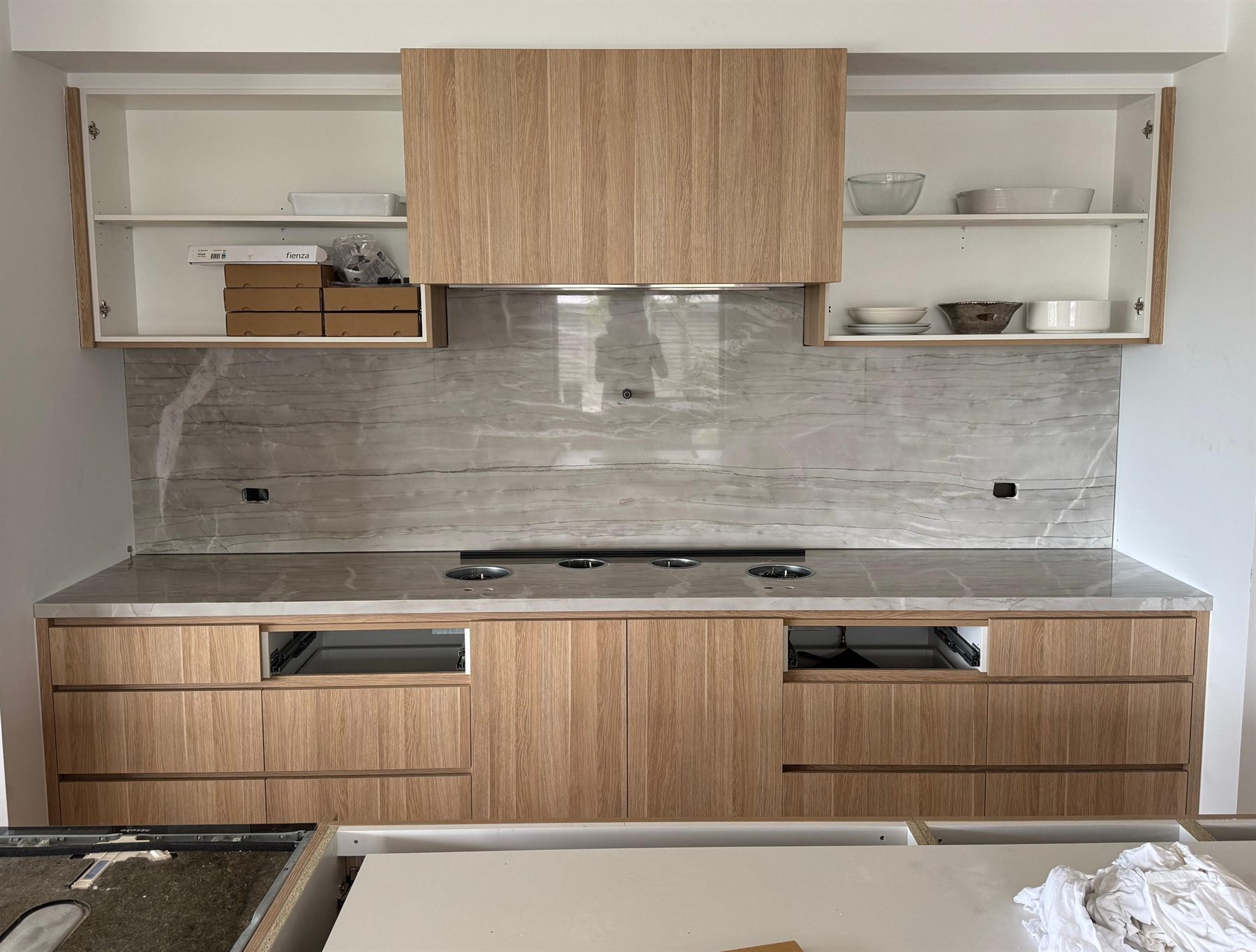Natural quartzite kitchen benchtop with matching splashback